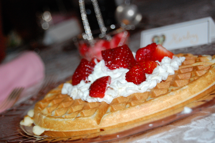 Waffle with whipped cream and strawberries