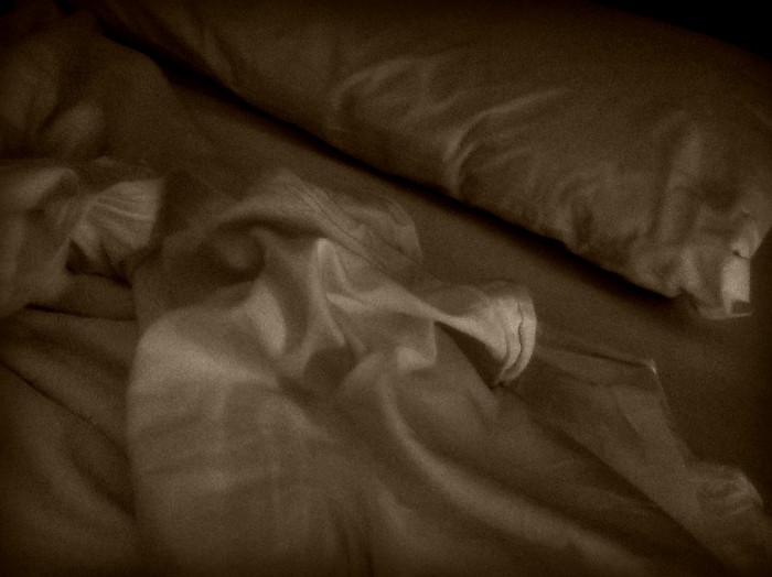 Messy bed from tossing and turning