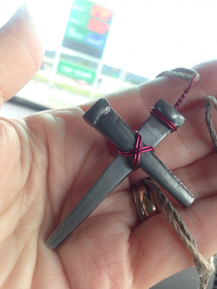 Cross necklace made of flattened nails